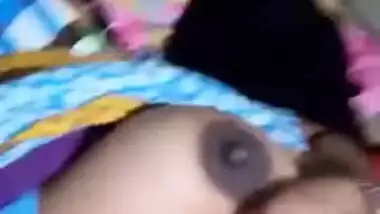 Pretty Desi MILF poses for the camera and teases with big XXX tits
